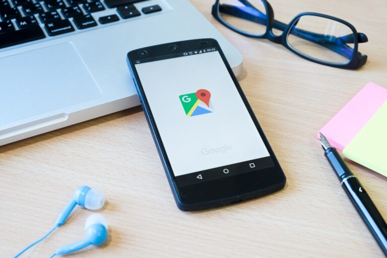 Smartphone displaying Google Maps on a desk, representing Google Business Profile verification and business listing setup for local businesses.