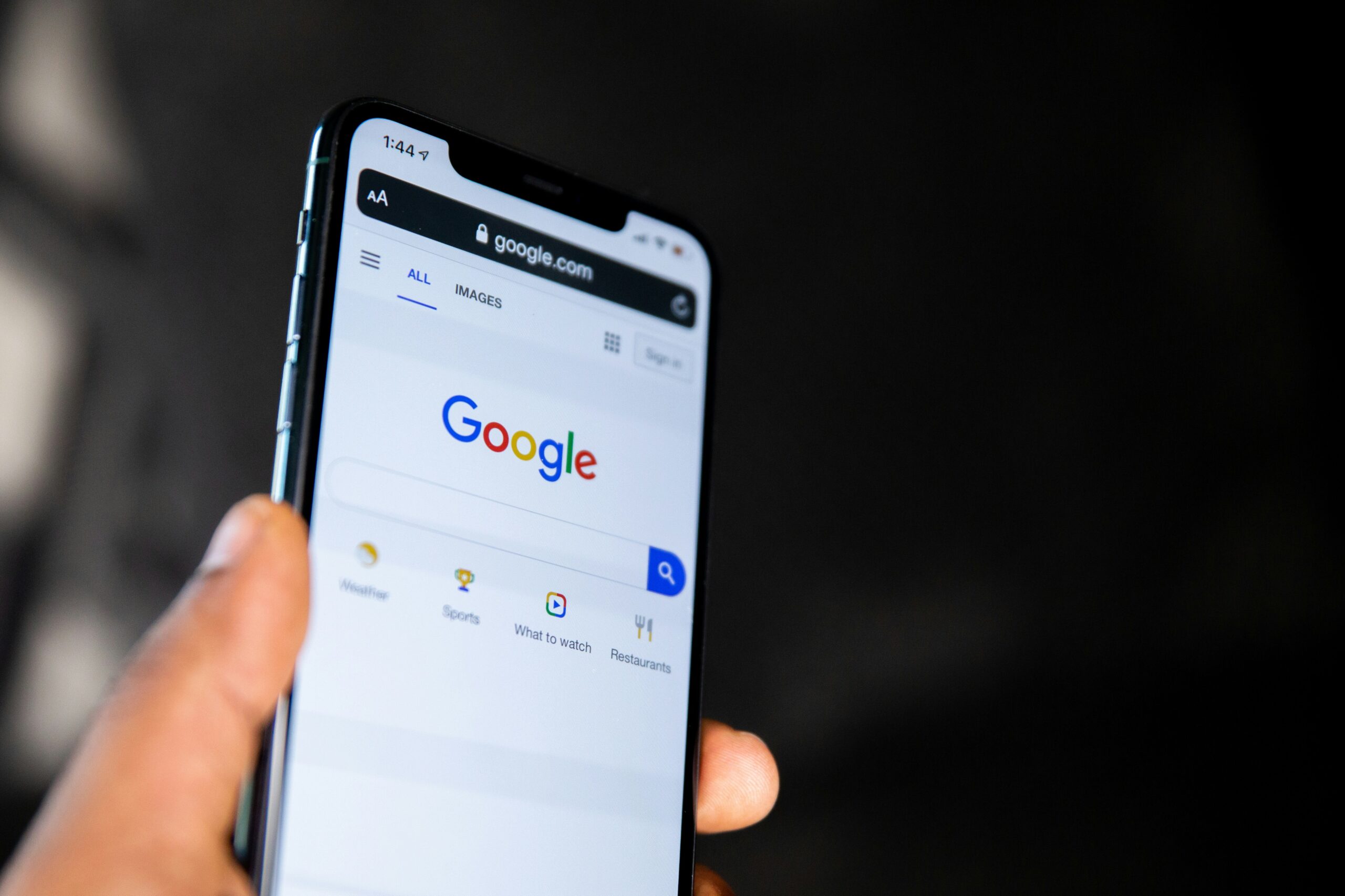 Google Search displayed on a smartphone, representing the Google Business Profile ranking factors that influence local search visibility.